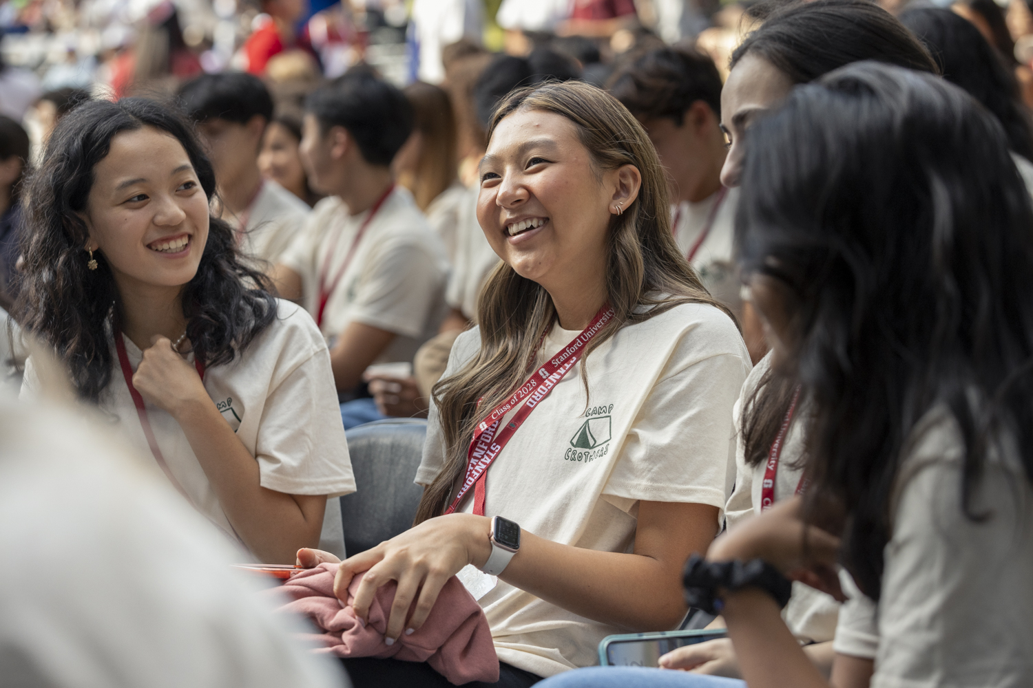 A close up of two students attending Convocation.