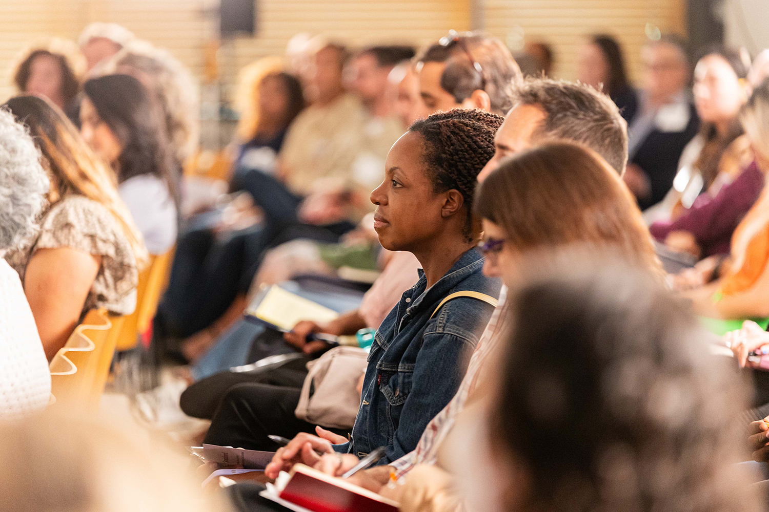 An image of the audience listening to the mission, vision, programs, and events planned by Stanford’s Institute for Advancing Just Societies.