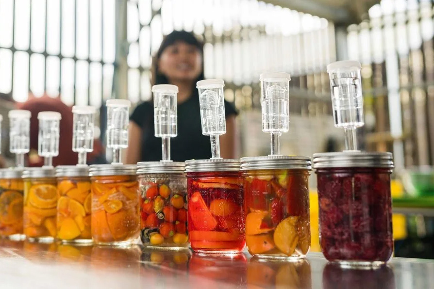 Jars of ferments on a table. 