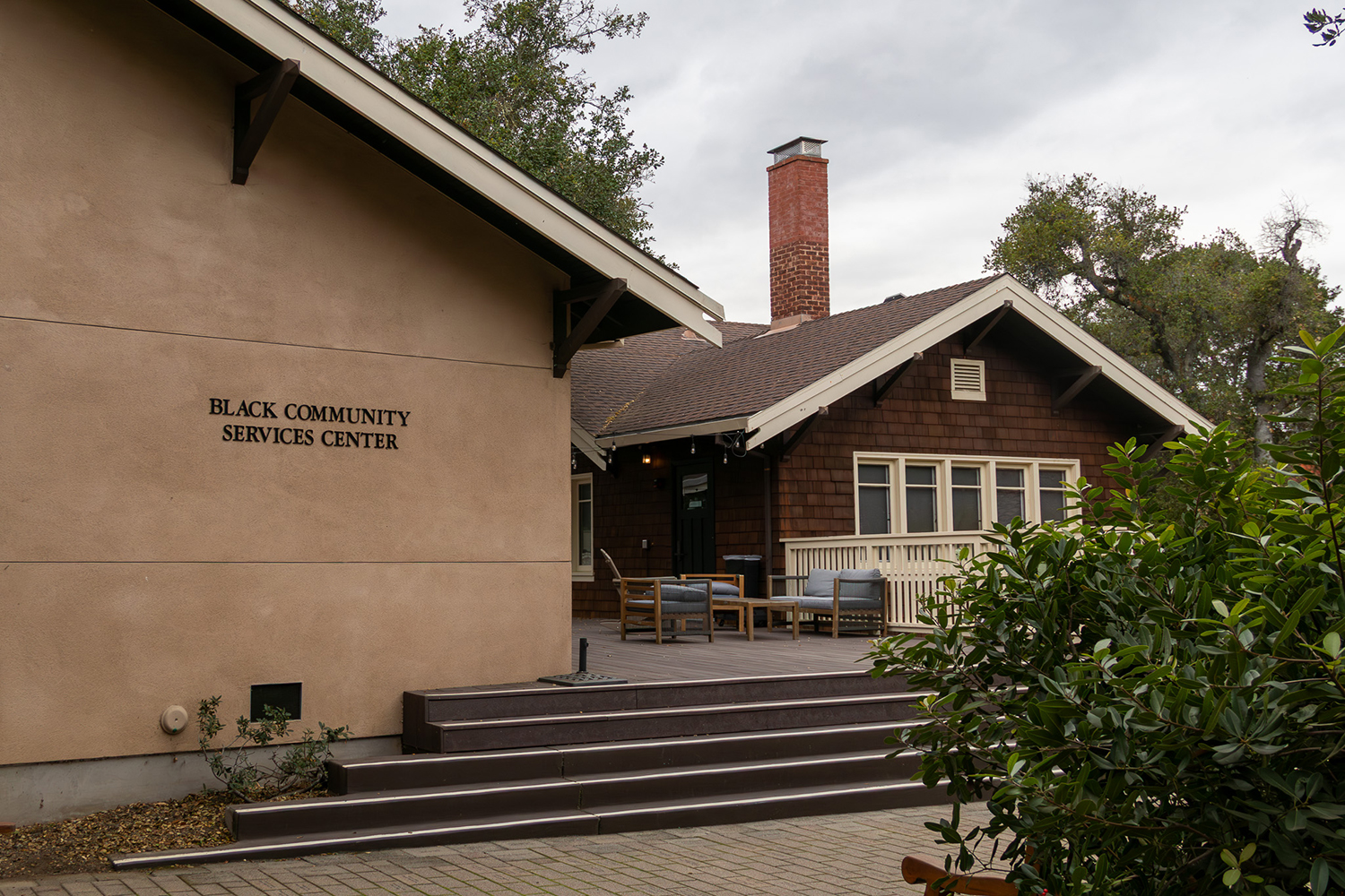 Outside of the Black House, featuring a blend of modern and traditional architecture, and outdoor seating areas.