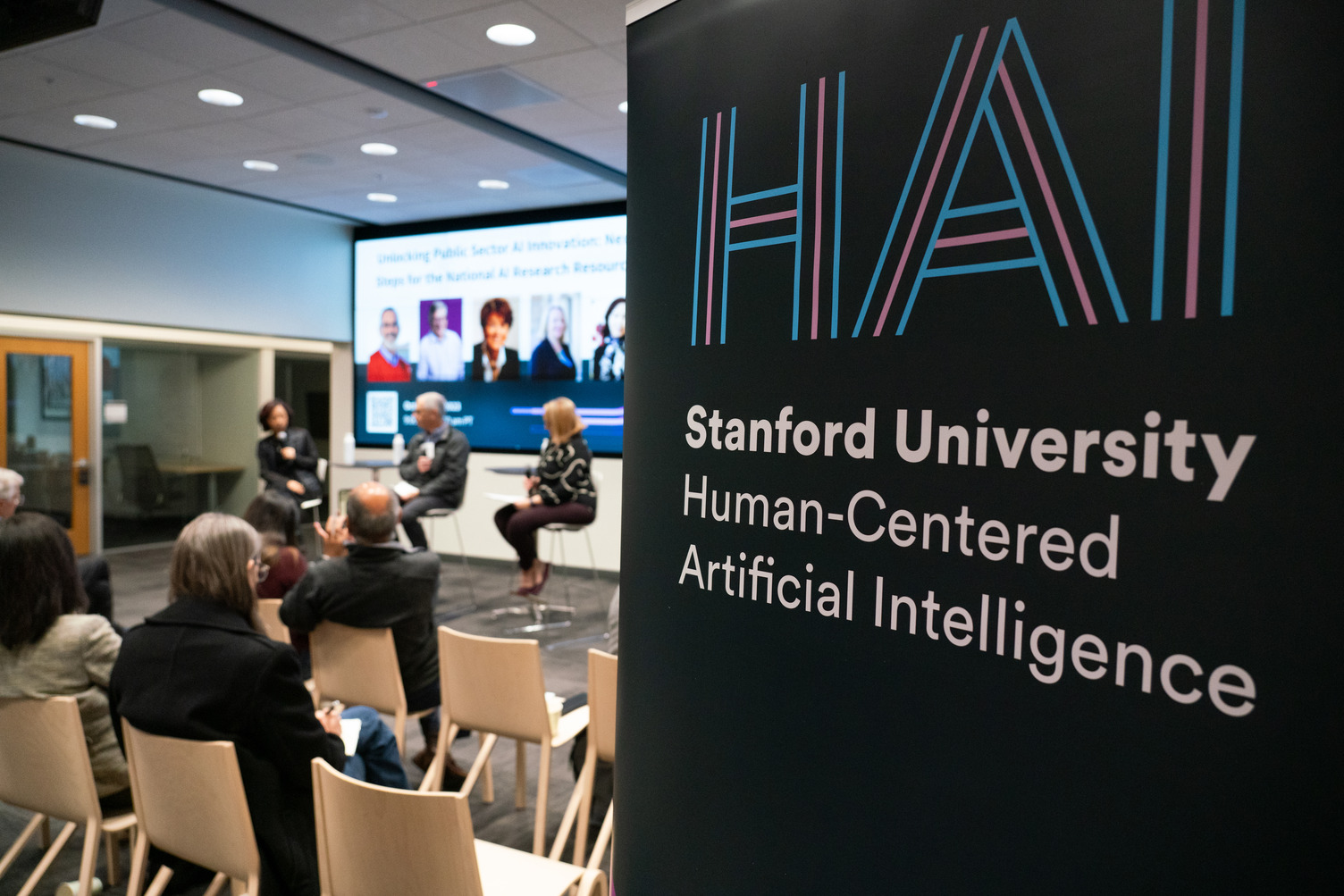 A sign for HAI at an event on campus
