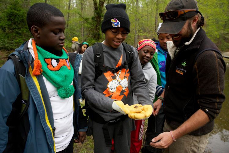 Middle-school students study the health of the watershed during an overnight visit to an environmental science camp in Prince William Forest Park in Virginia.)