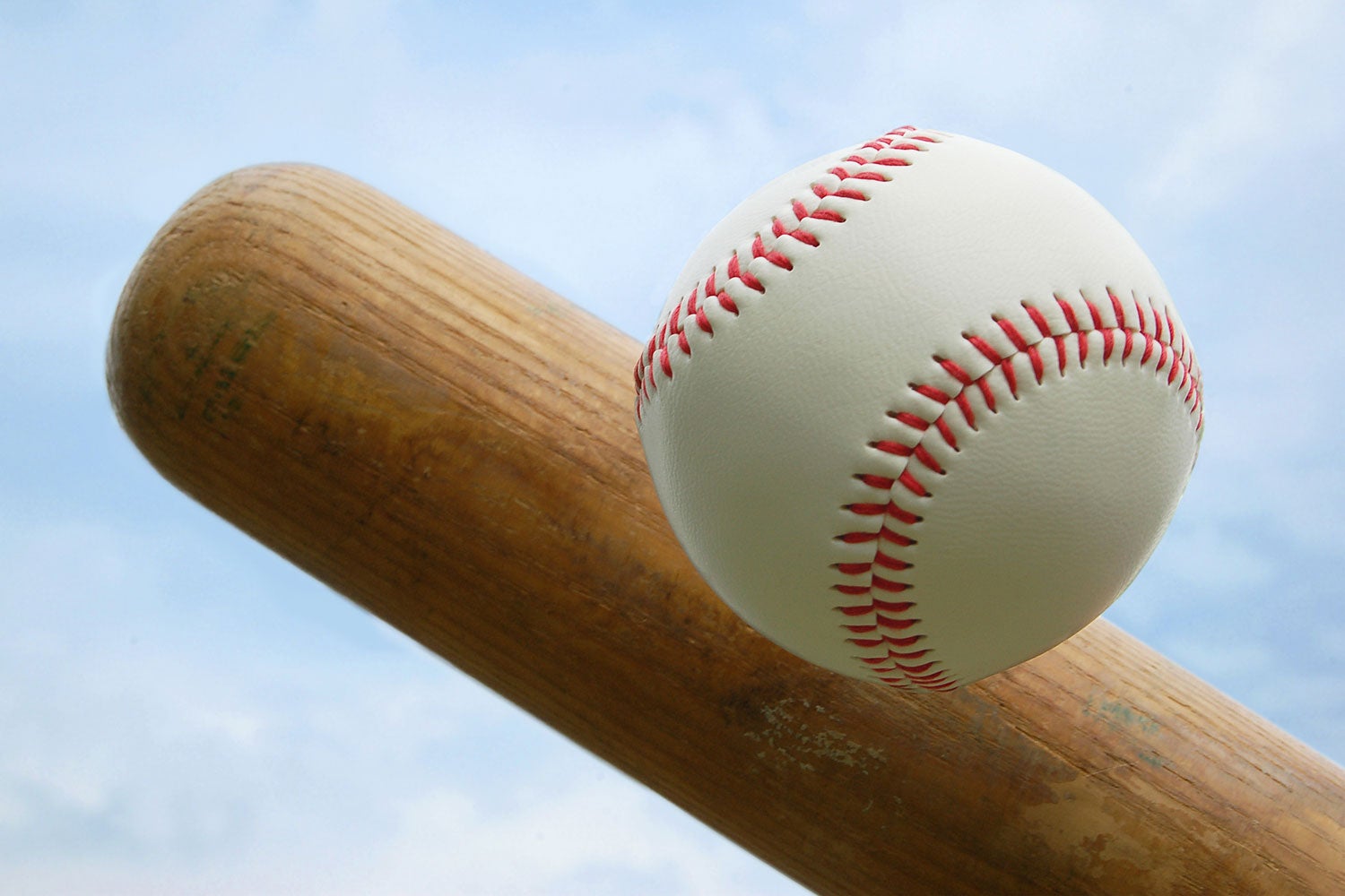 closeup of baseball and end of bat