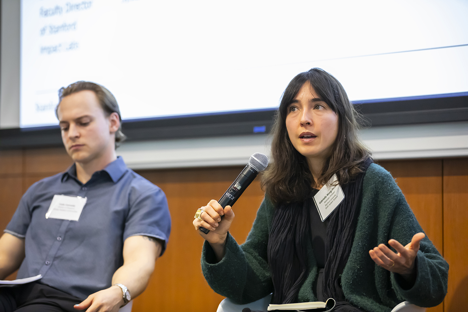 Image of Gabrille Wong-Parodi and Cade Cannedy during a panel discussion of academic-policy partnerships.