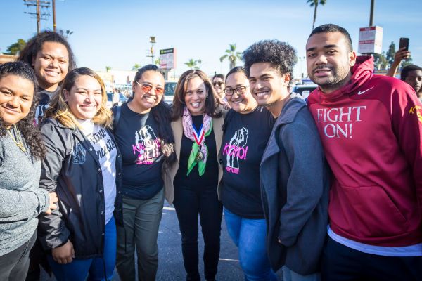 Kamala Harris with a group of people at the Los Angeles Kingdom Day Parade 2018