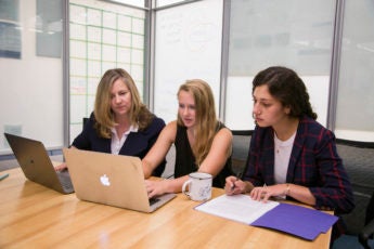 English lecturer Alice Staveley, left, meets with Stanford junior Emily Elott and second-year English doctoral candidate Anna Mukamal