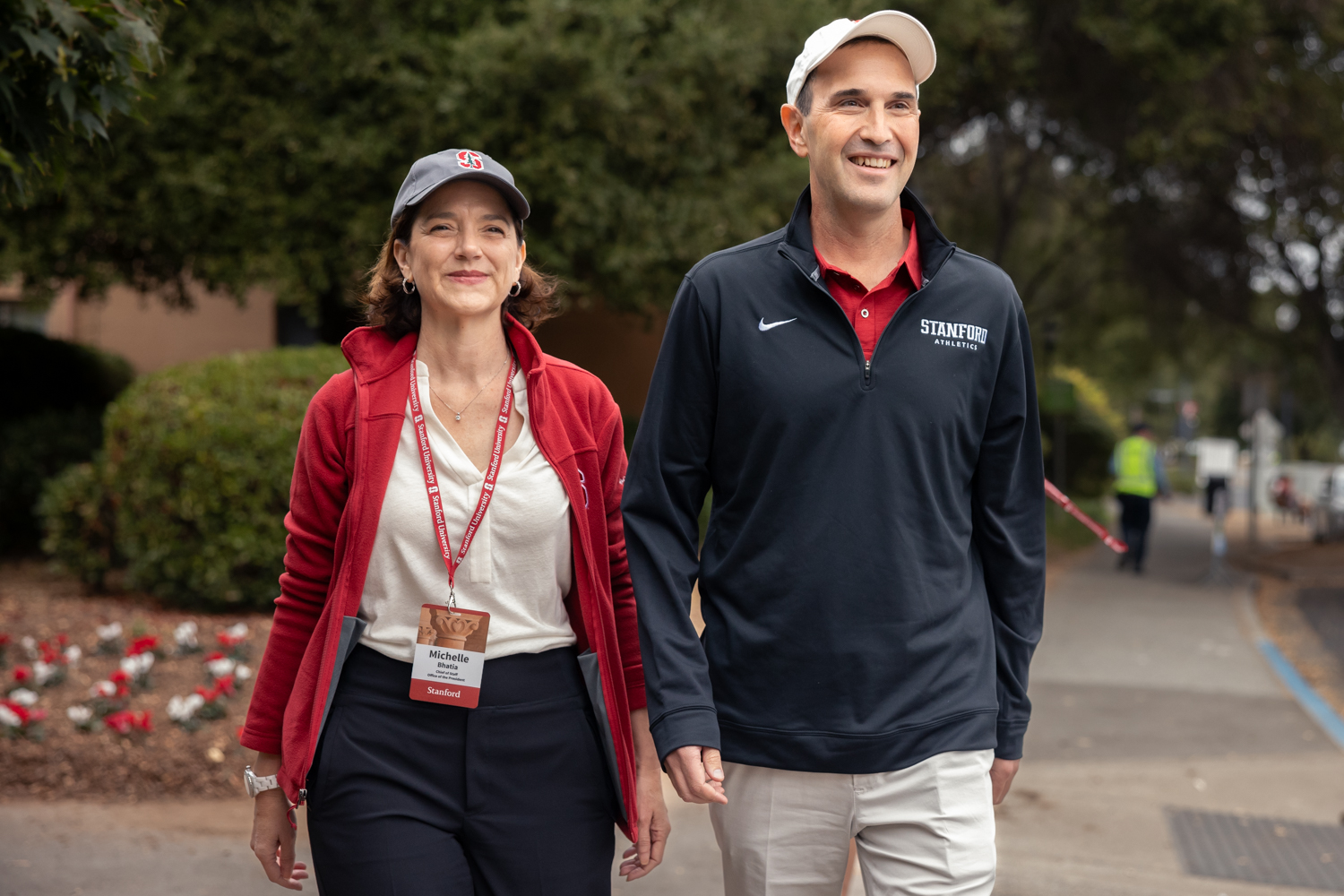 Stanford's new president Jon Levin arrives at New Student Orientation with a member of his staff.