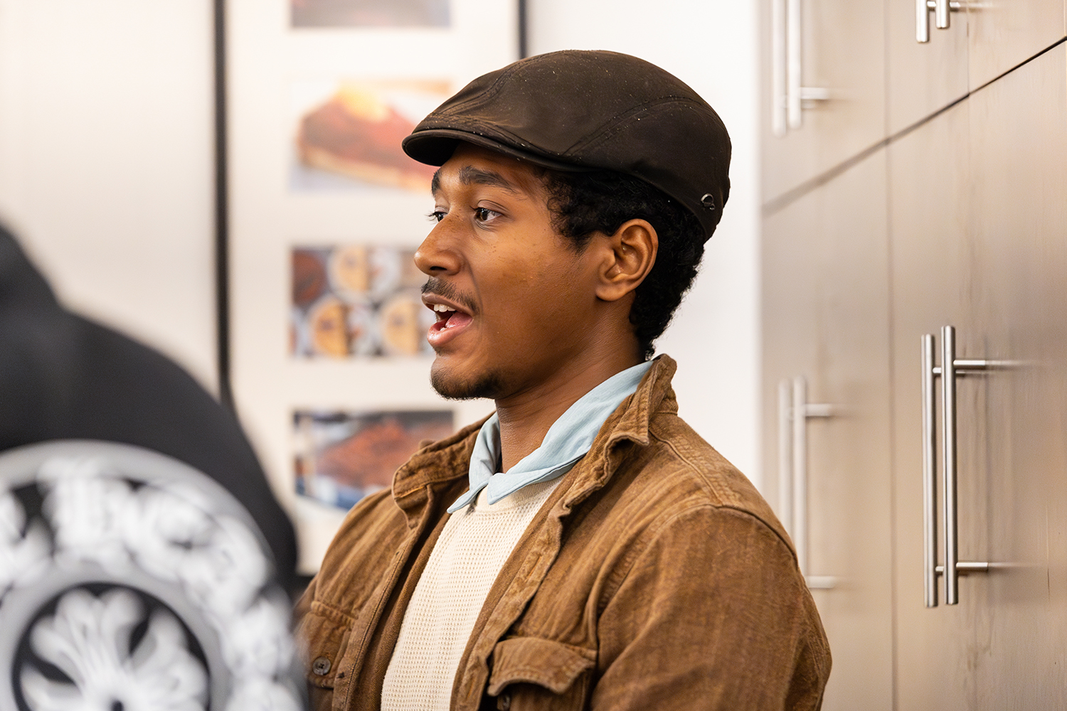 Jayden Moore sitting and talking to fellow undergrads during a Civic Salon.