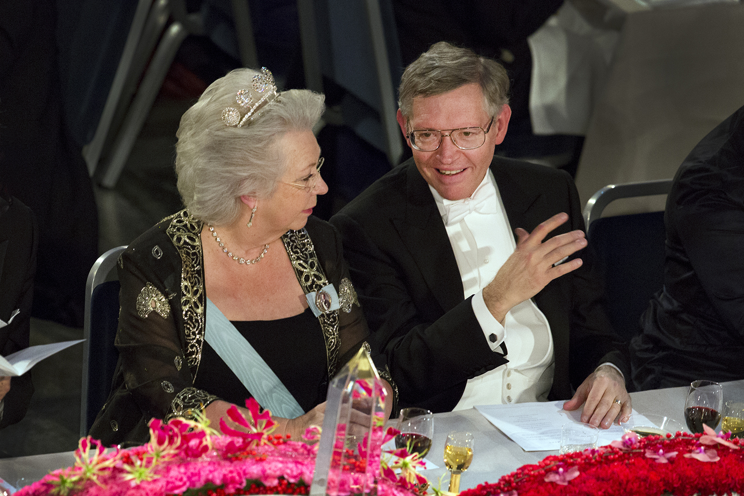 Princess Christina of Sweden and W.E. Moerner sit together at the table of honor at the Nobel Banquet. 