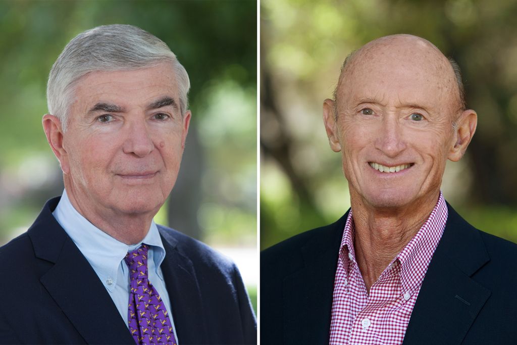 Side by side profiles of H. Irving Grousbeck and Charles A. Holloway, wearing professional attire, and both standing against a blurred outdoor background.