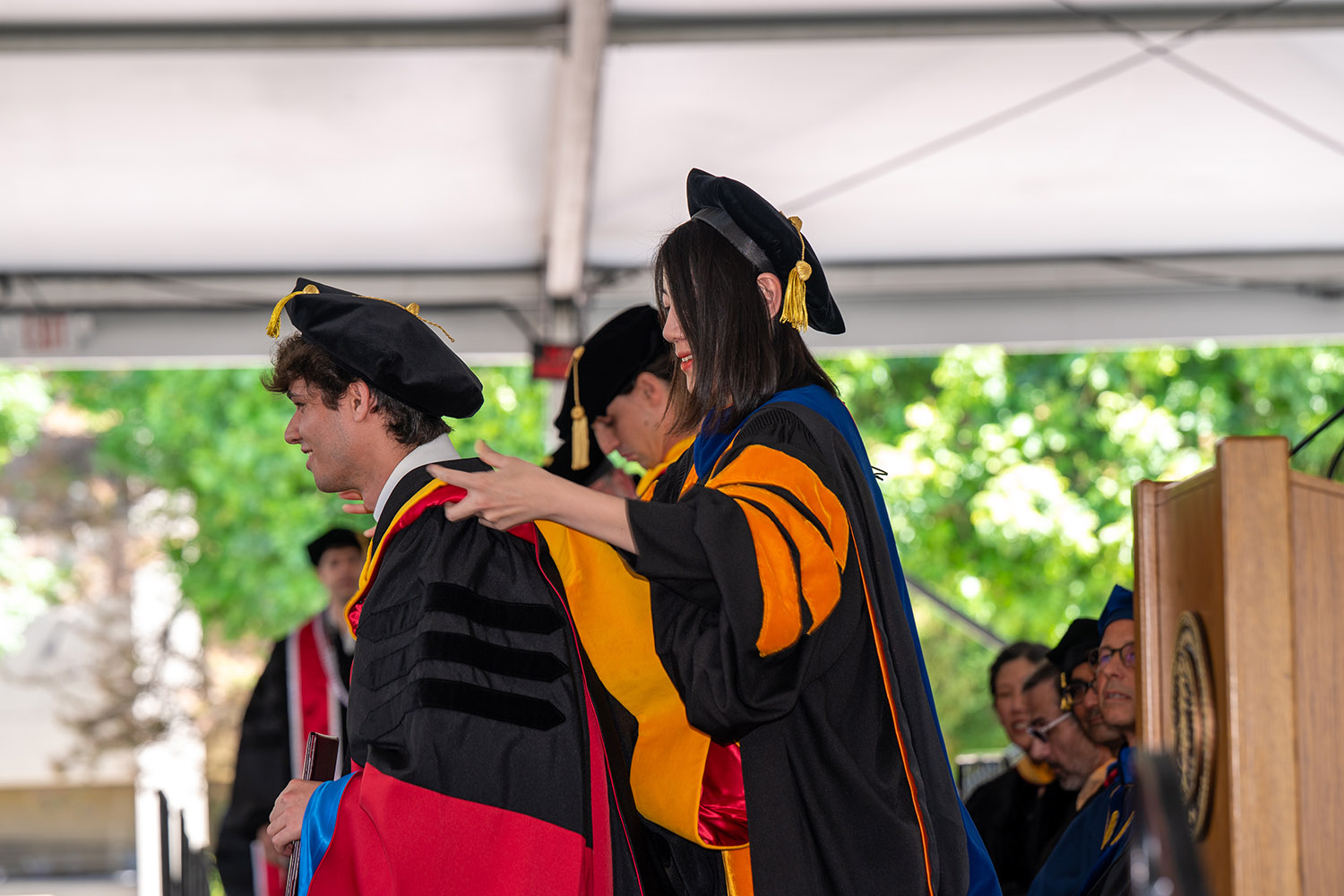 Doctoral candidate receives his hood.