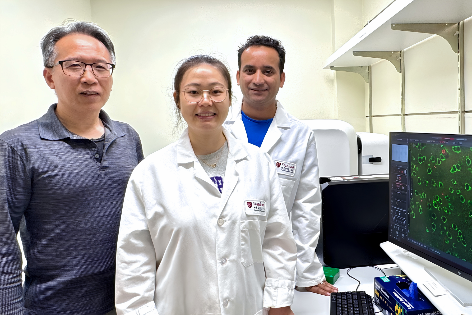 Bingwei Lu, Wen Li, and Suman Rimal in the lab