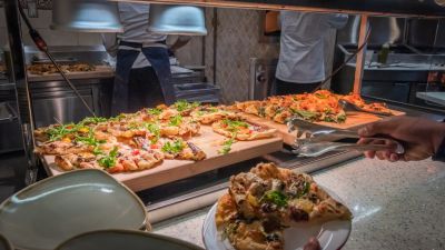 Pizzas on a serving dish.