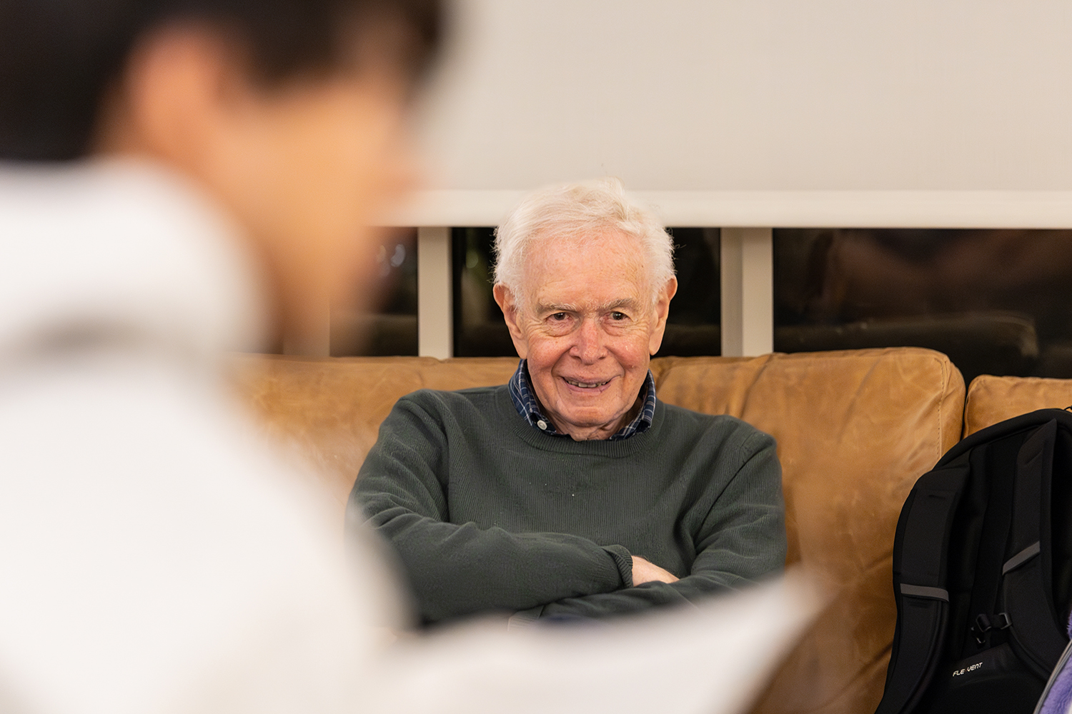 Paul Brest sitting and talking to students during a Civic Salon.