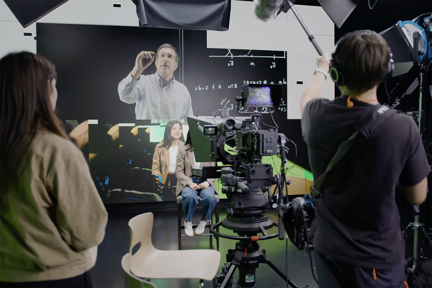 Open video Film crew producing video content on a green screen set with professional cameras and lighting equipment. in a modal