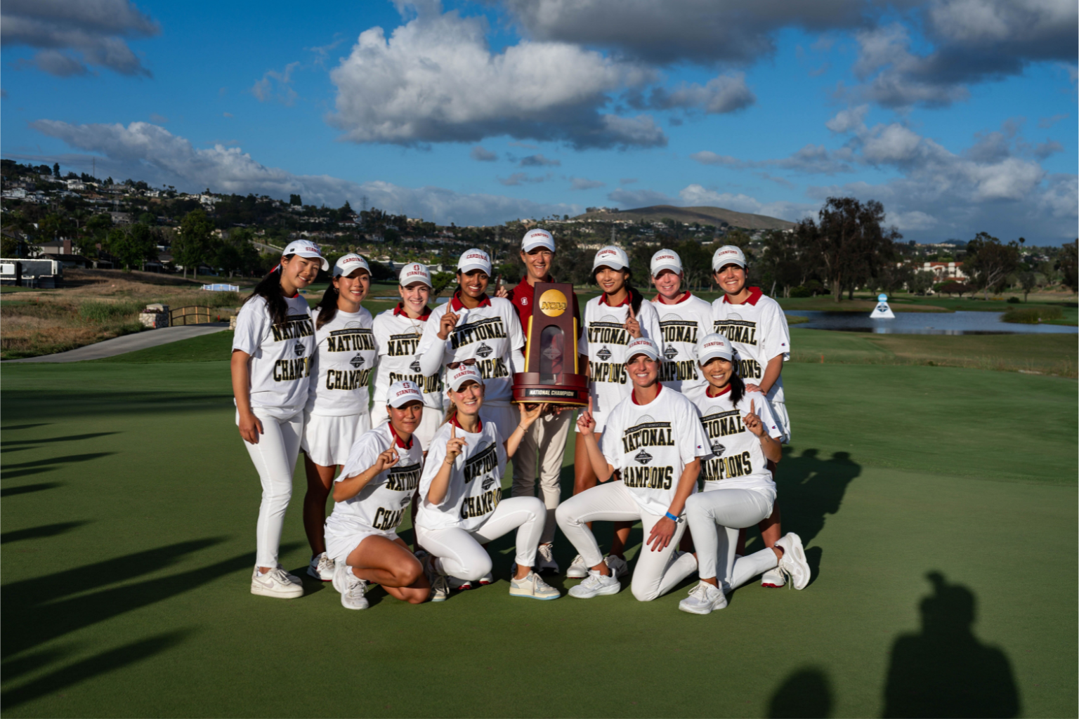 The women's golf team stands together after winning the NCAA championship
