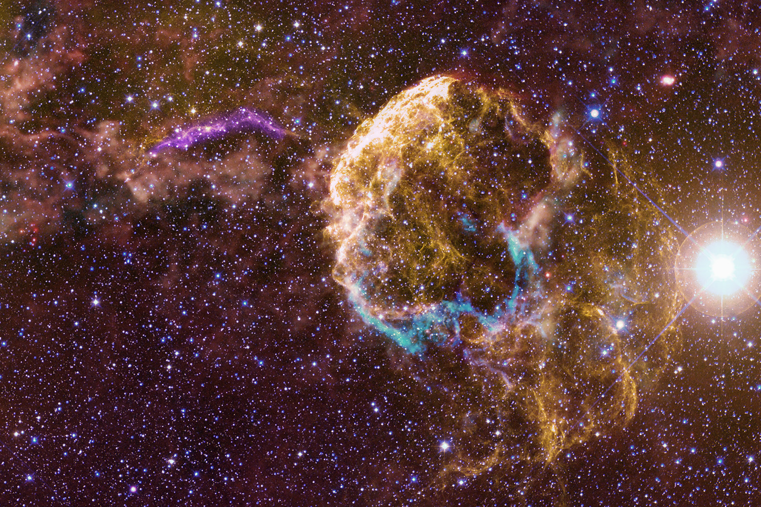 A vibrant nebula glows in space surrounded by countless stars, showcasing cosmic dust and stellar formations.
