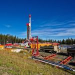 fracking rig near forested area