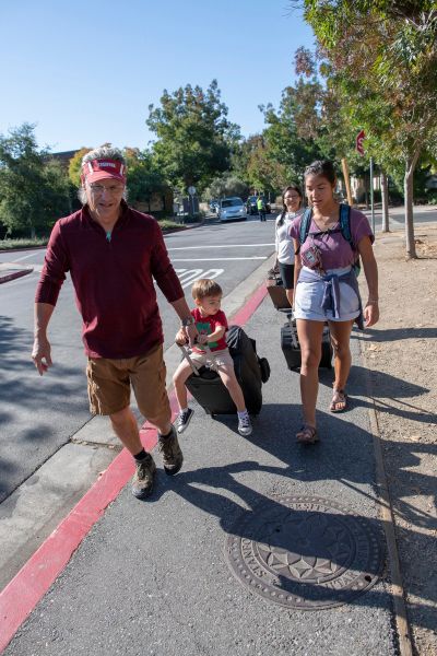 First-year student Maza Hixson moves into Stern Hall with the help of her family, including mom, Janice Hixson, and nephew Niall Blake, 2, who gets a ride from Jim Hixson, her dad.