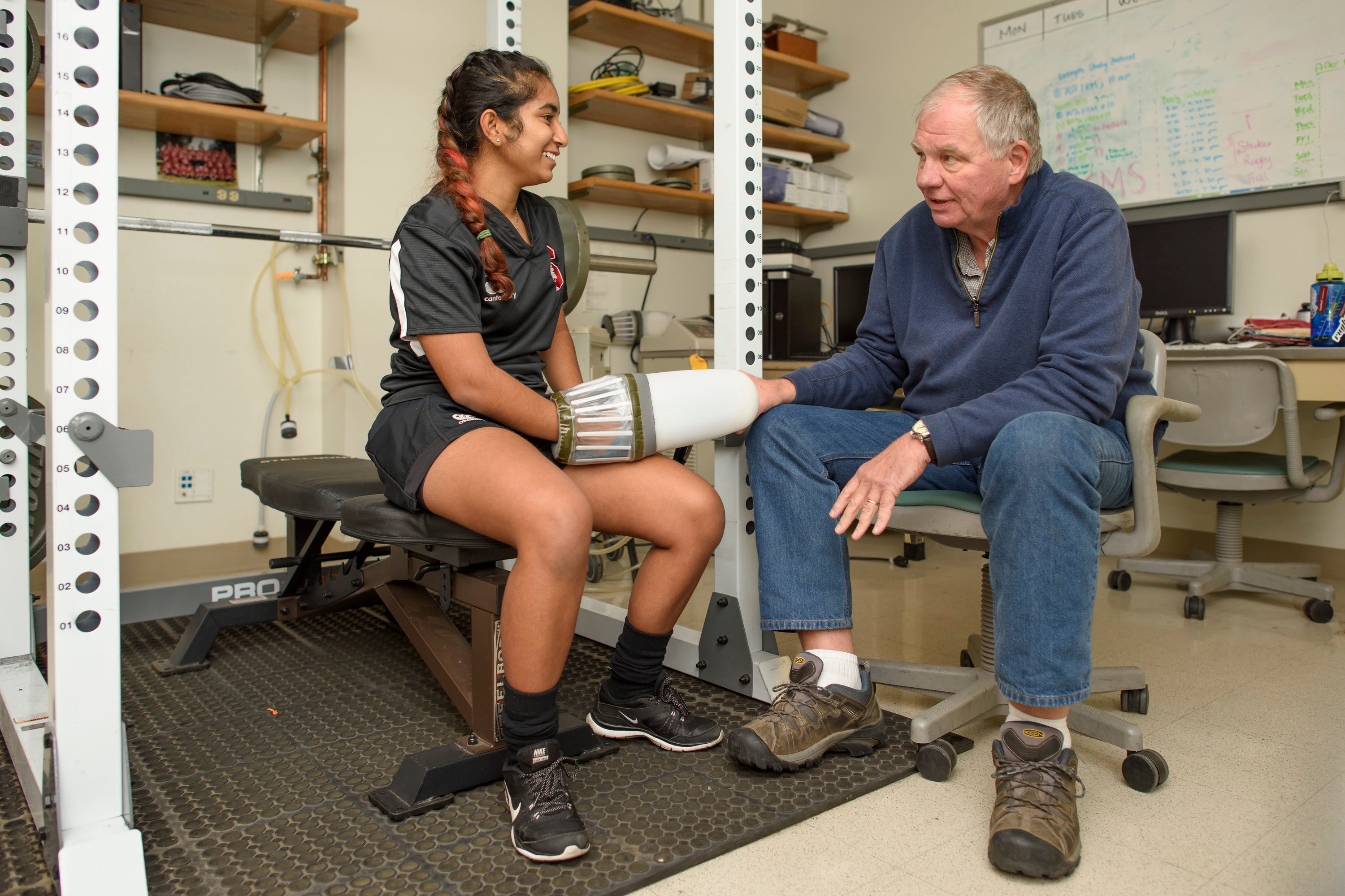Senior research scientist Dennis Grahn meets with student research assistant Riasoya Jodah, a Women’s Rugby team member. Jodah has been working with Heller and Grahn to test the effects of the cooling glove on strength conditioning training.