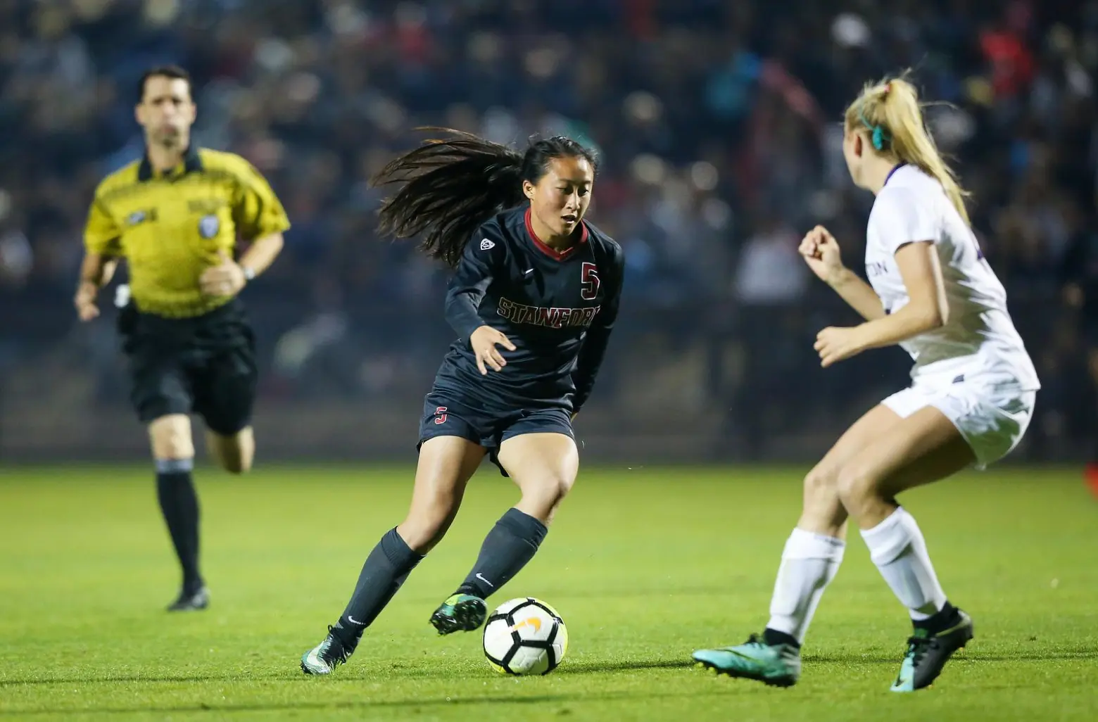 Michelle kicks the ball during a Stanford soccer game.