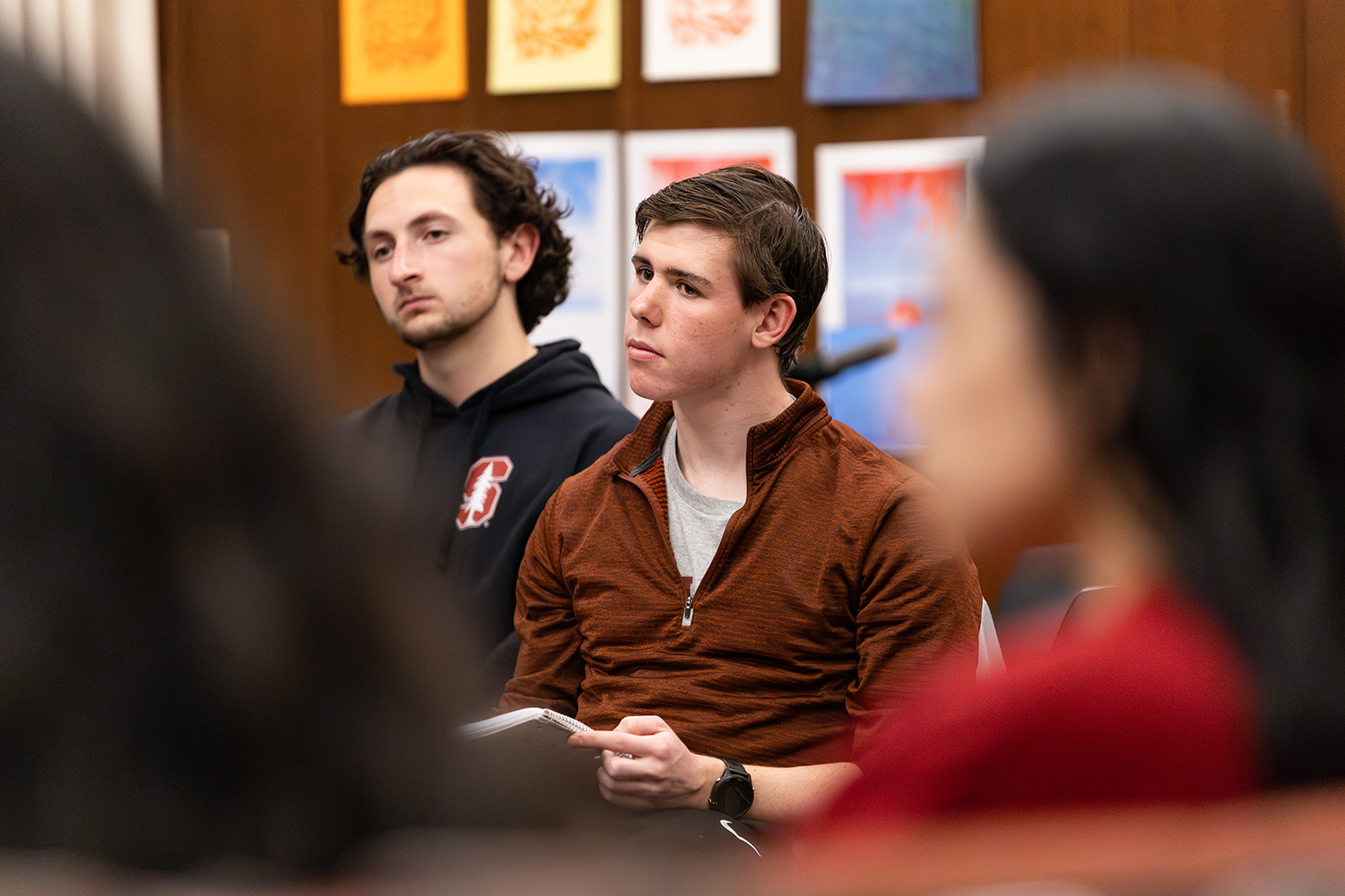 Will Gibbs sitting and talking to fellow undergrads during a Civic Salon.