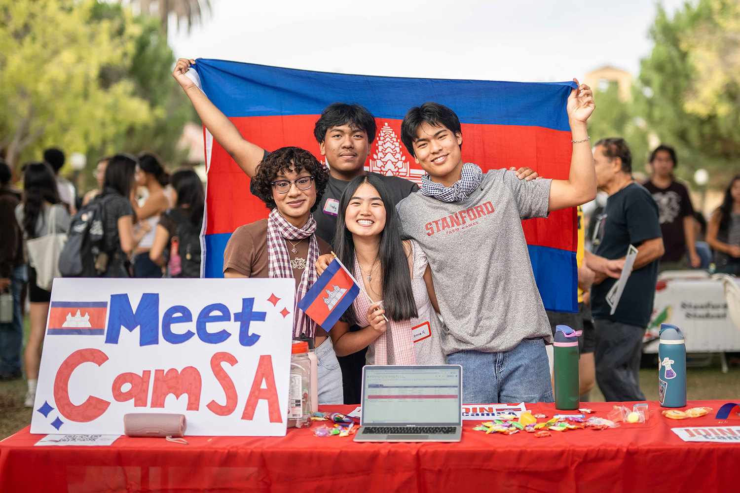 Image of CamSA club members posing with the Cambodian flag at the 2025 Festifall event.