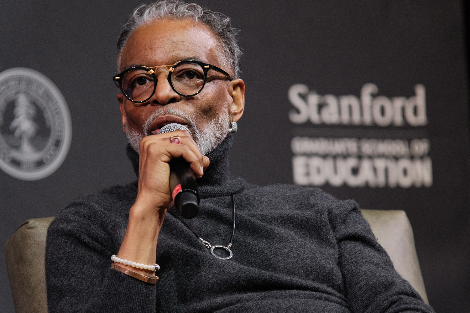 LeVar Burton speaks into a microphone during an event hosted by Stanford Graduate School of Education.