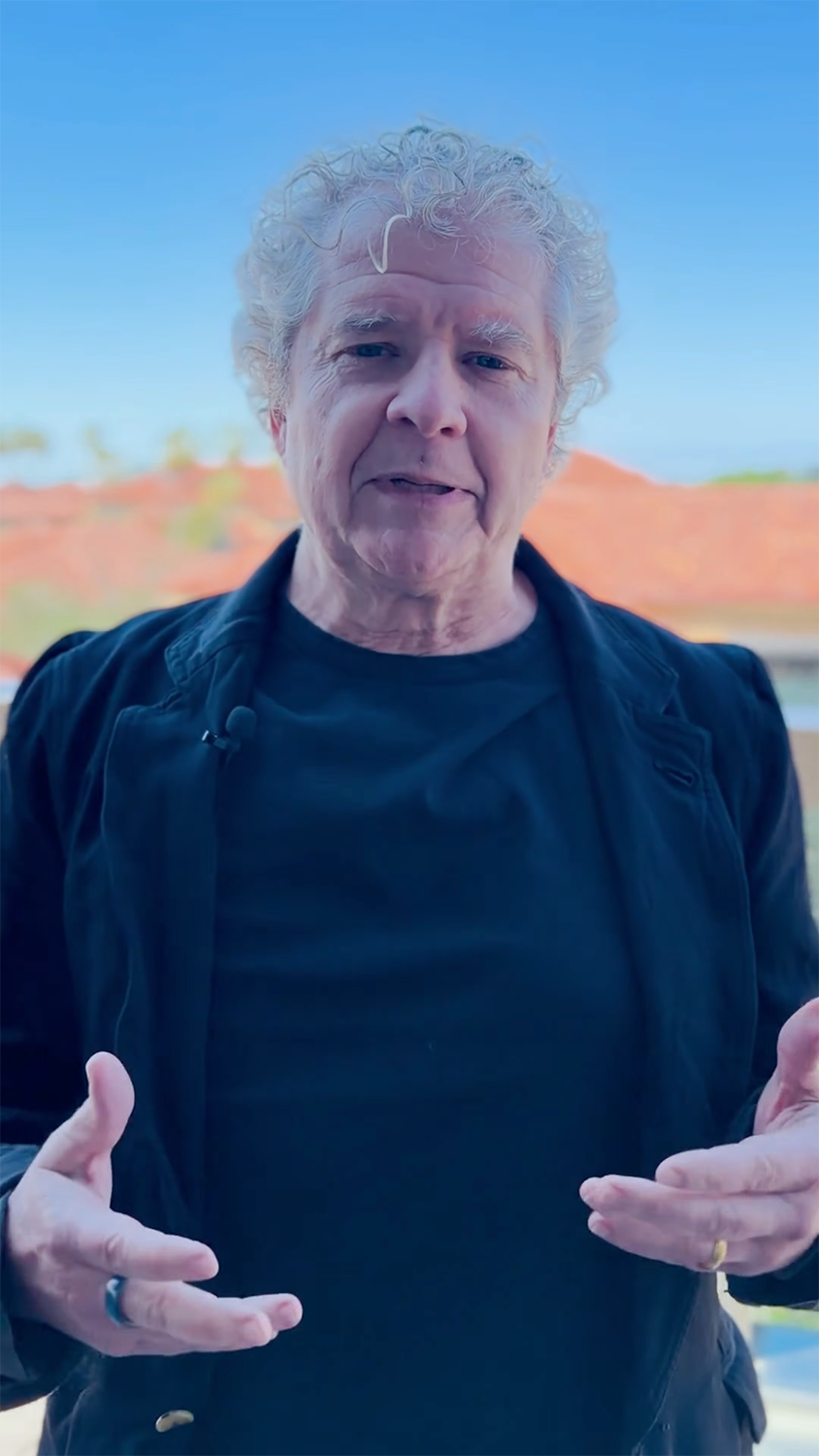 Sean Reardon standing outdoors and speaking into the camera during an interview.
