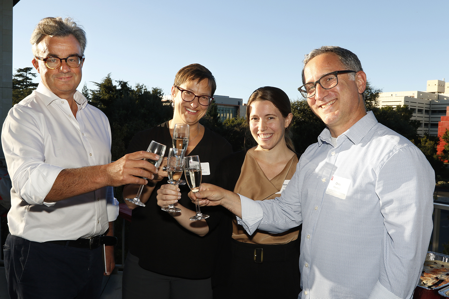 Pictured are Emmanuel Candès, Risa Wechsler, Susan Clark, and Chris Mentzel posing for a photo at the Center for Decoding the Universe fall forum.