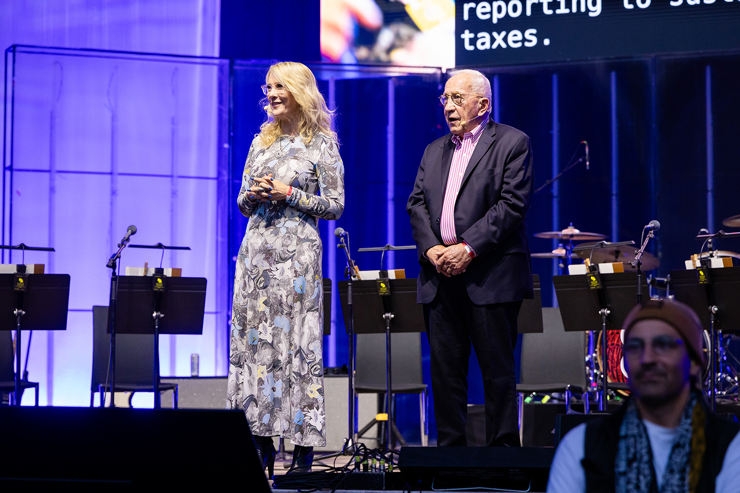 Jennifer Aaker and George G.C. Parker speak on stage.