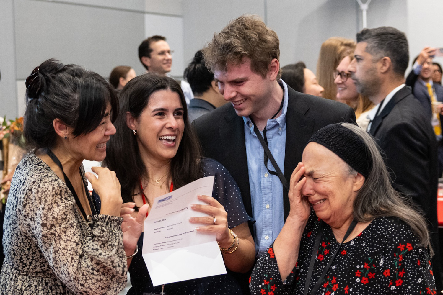 Maria Isabel Barros Guinle surrounded by members of her family as they celebrate during Match Day.
