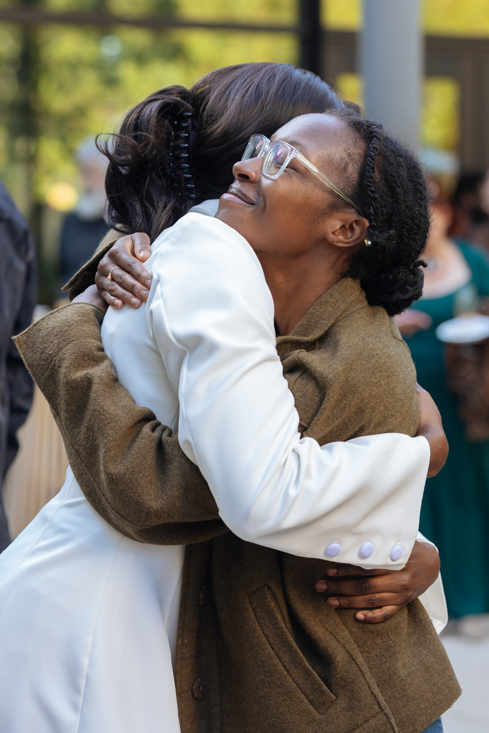Ibukun Ajifolokun and a friend hugging outdoors after the competition.