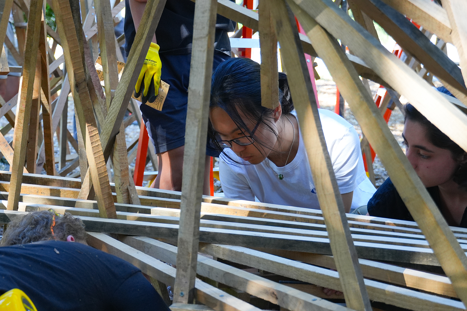 Closeup of students working on the construction