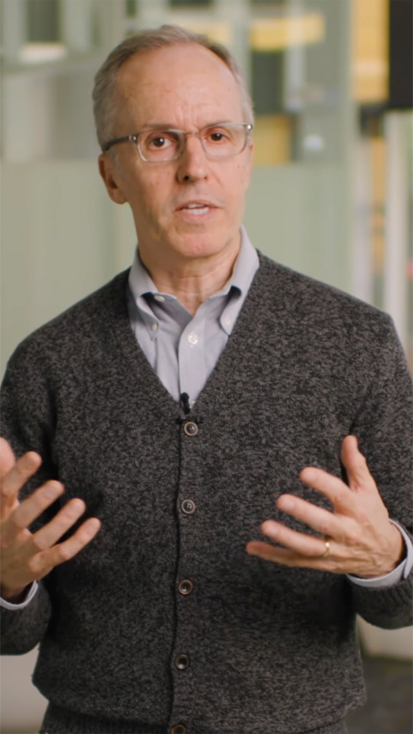 Vertical screenshot of Curtis Langlotz speaking into the camera about his research.