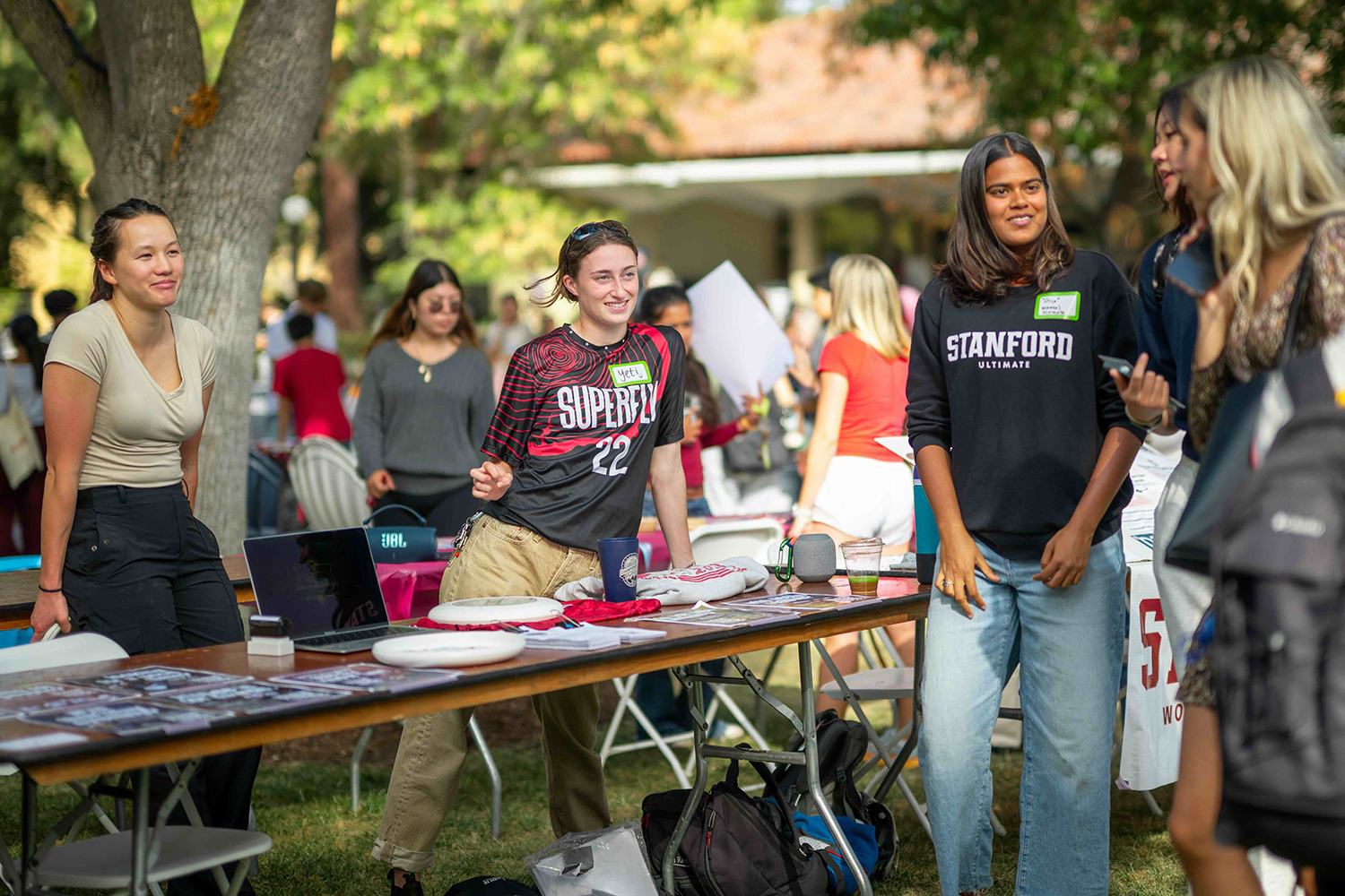 Image of members of the Stanford Ultimate Frisbee meet with Festifall attendees.