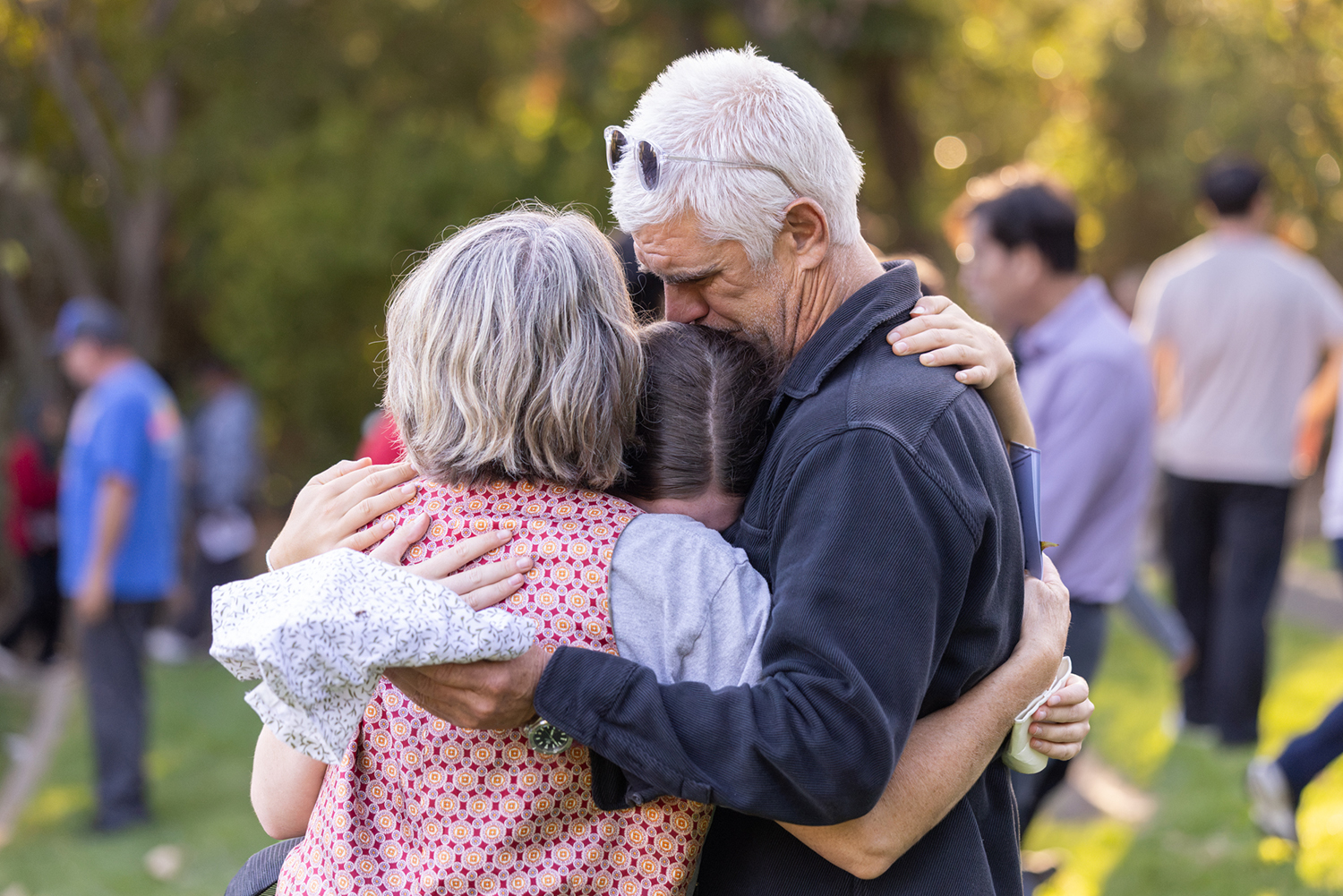 Parents embrace their student during Convocation.