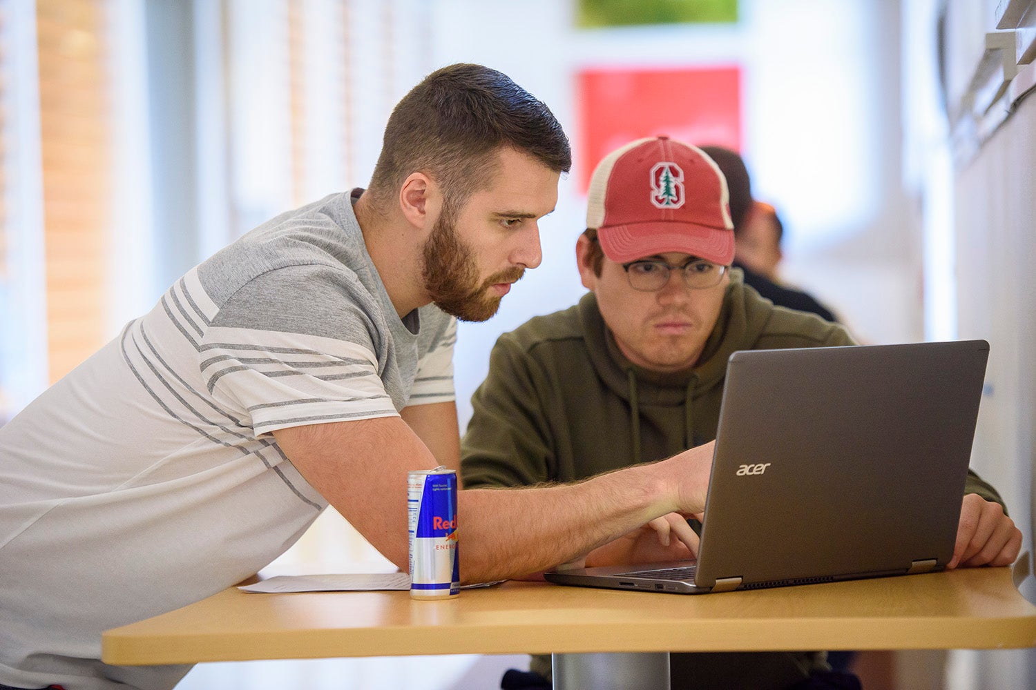 Garrett Gross, left, and Hugo Santos Parada, discuss an assignment