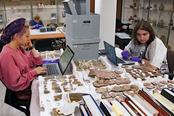 Students working in archaeology center