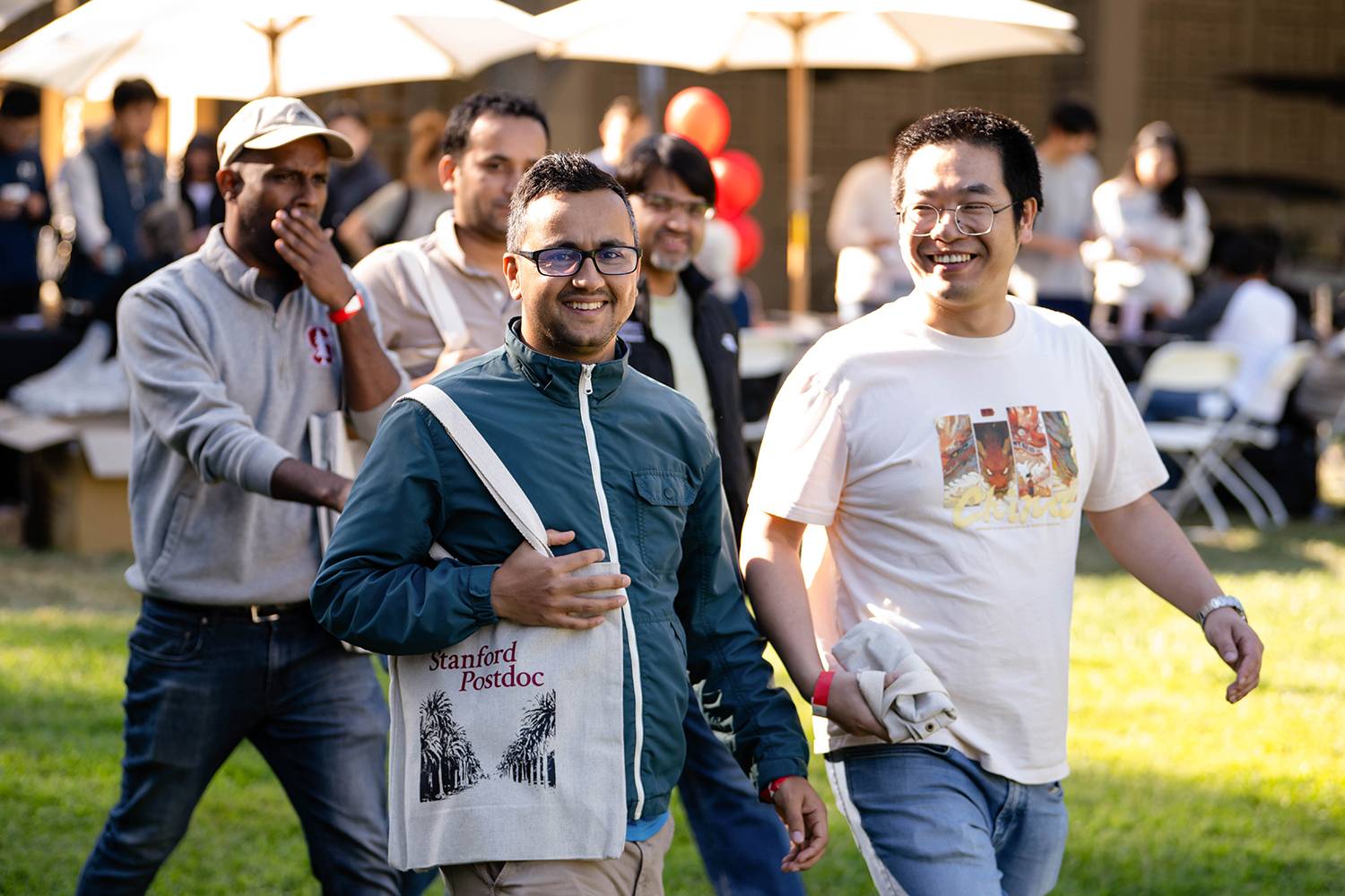 A picture of two people walking through the venue.