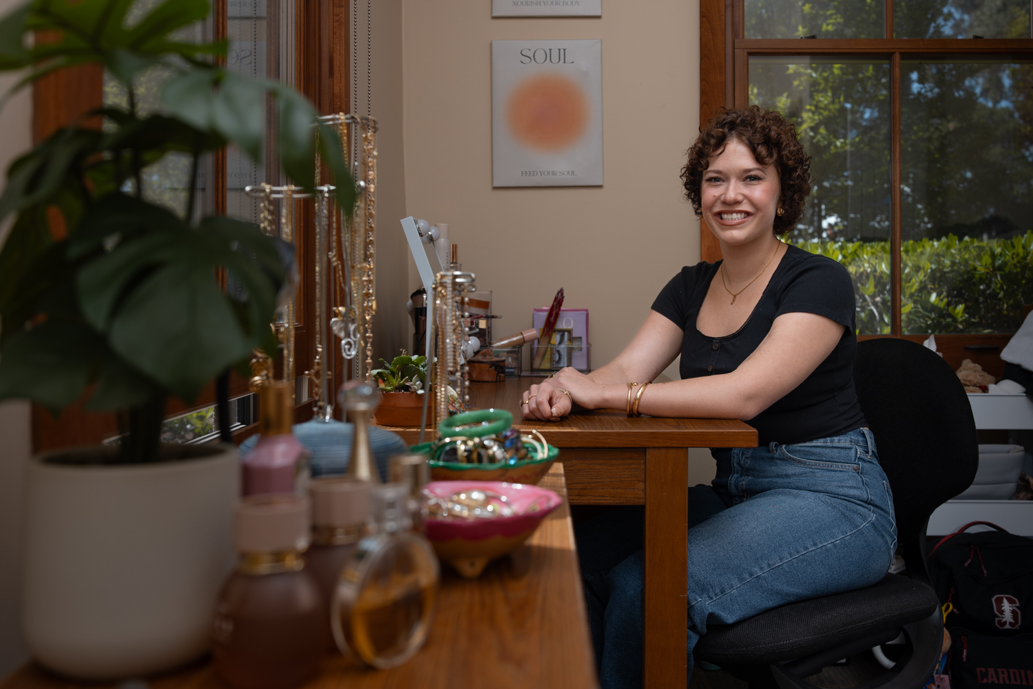 Josie Fabian sitting at a desk, smiling