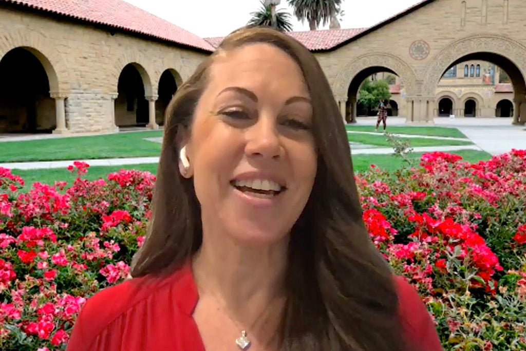 Cheryl Brown in front of a virtual background of Memorial Court