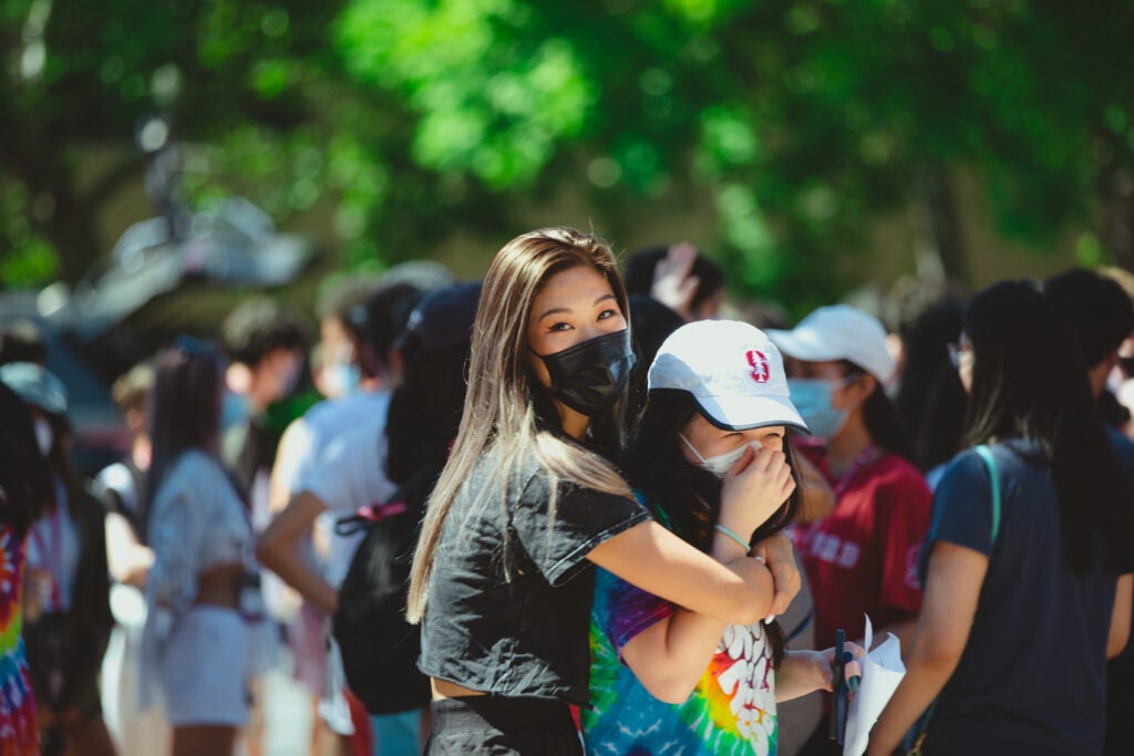 Two female international undergraduate students hug during orientation this fall