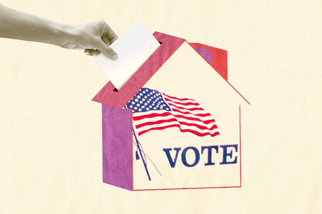 Illustration of a hand reaching out and dropping a ballot into a ballot box shaped like a house, with the word "vote" and an American flag on it.