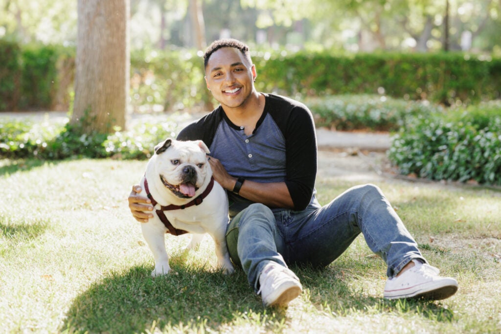 Portrait of Orlando with his arm around his dog ZsaZsa