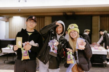 Students in costume with snacks at Tresidder