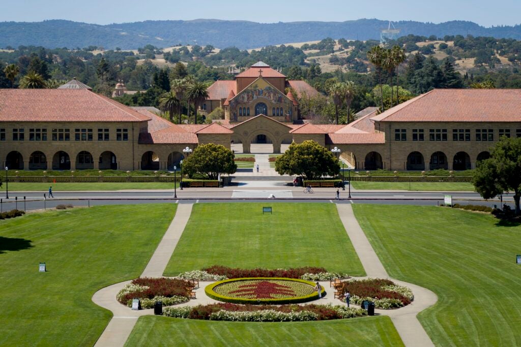 Looking past the green grass of the Oval at the front of Stanford's campus.