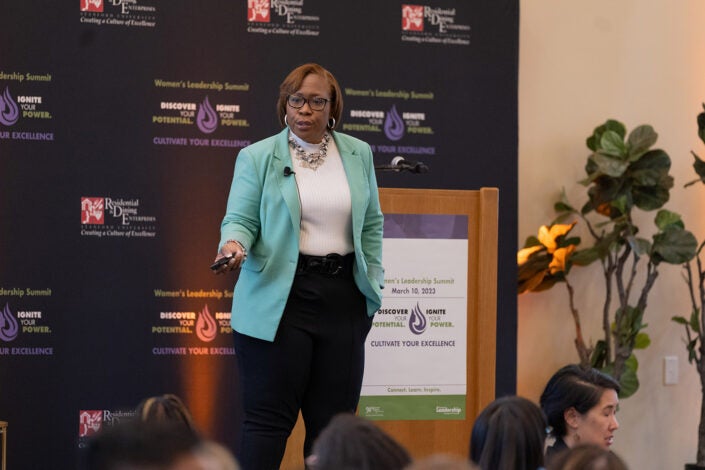 DeAngela Burns-Wallace gives the opening keynote, speaking on leading through empowerment, at Women's Leadership Summit.)