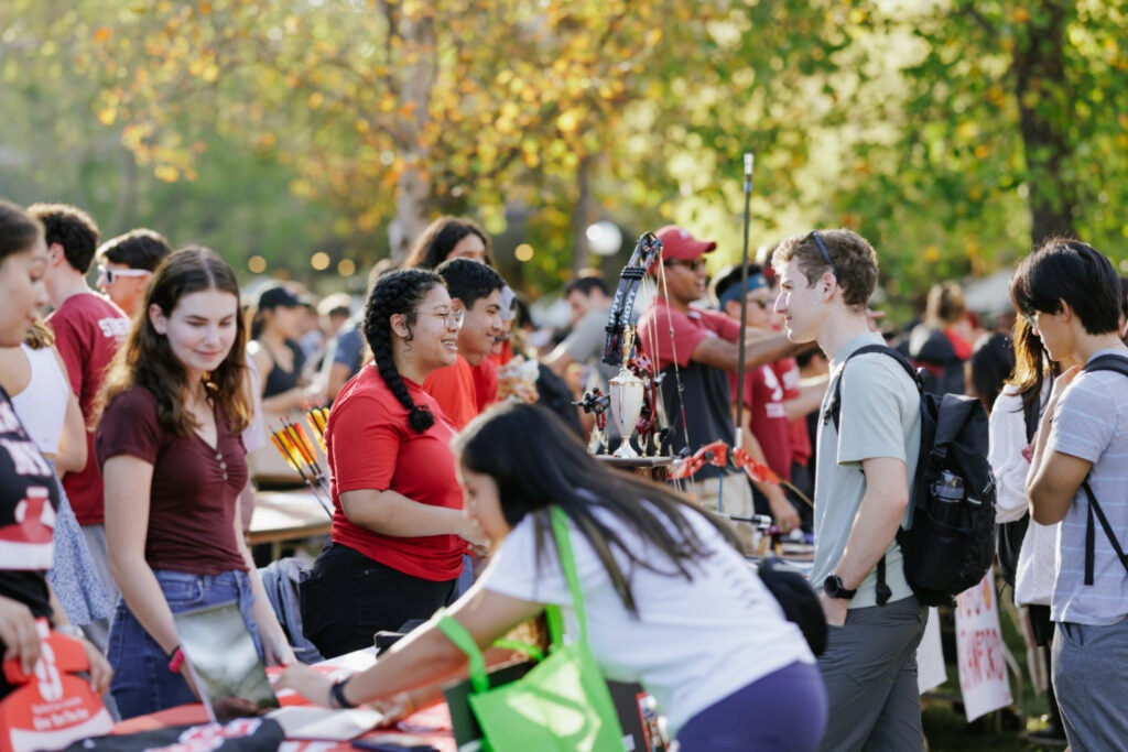 Image shows students tabling at White Plaza during Festifall, the student organization fair held each fall quarter