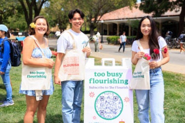 Three students with tote bags on their shoulders